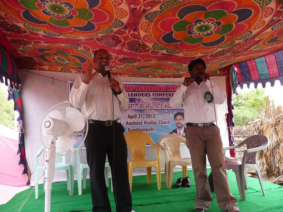 Rural pastors receiving BSI Scriptures at a distributors meet