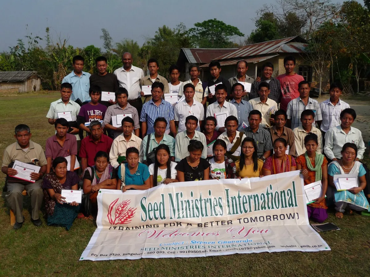 Karisanai team distributing clothing and essentials in a village