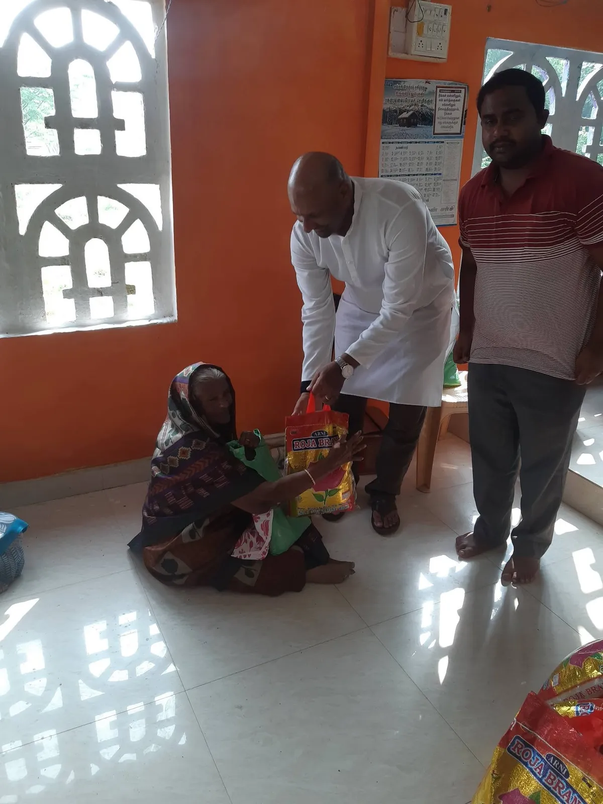 Children receiving stationery and school supplies through Karisanai